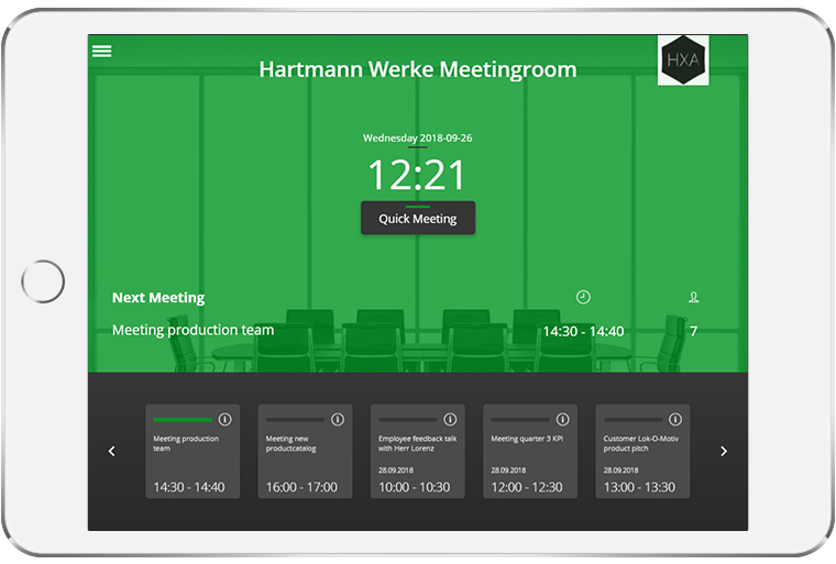 iPad displaying the room booking system that the meeting room is unoccupied